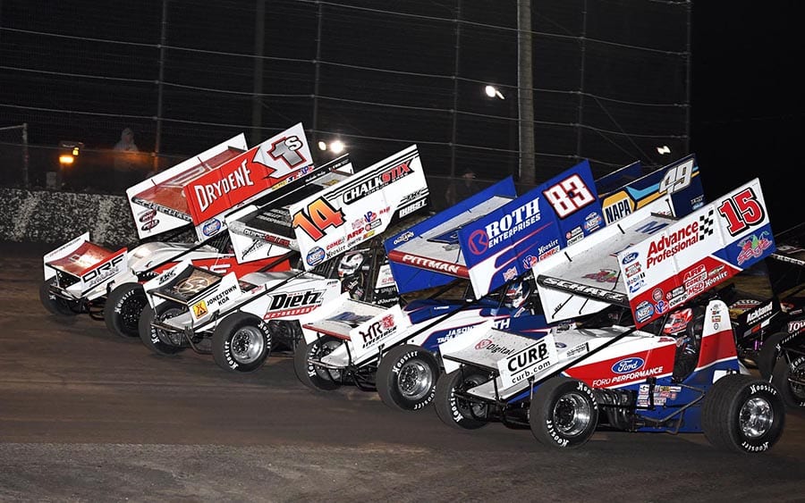 The World of Outlaws NOS Energy Drink Sprint Car Series field goes four-wide to salute the fans Friday evening at Volusia Speedway Park. (Frank Smith Photo)