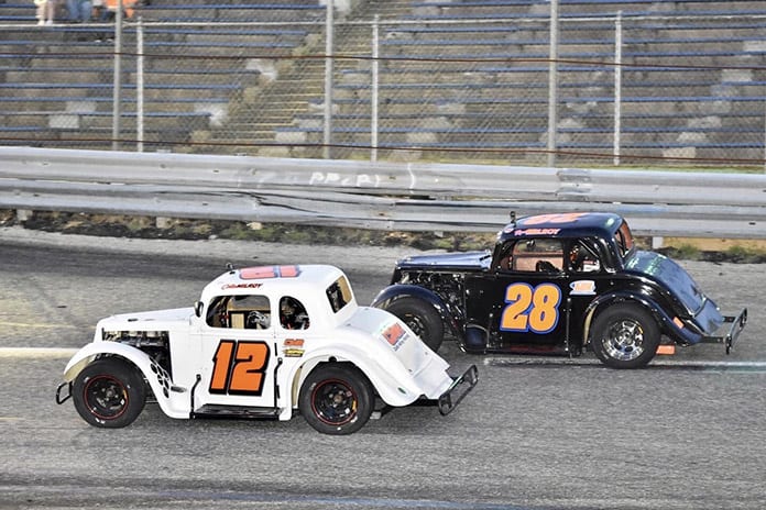 Collin Milroy (12) races alongside his brother Ronnie Milroy at New Jersey's Wall Stadium Speedway. (JJ Lane Racing Photos)