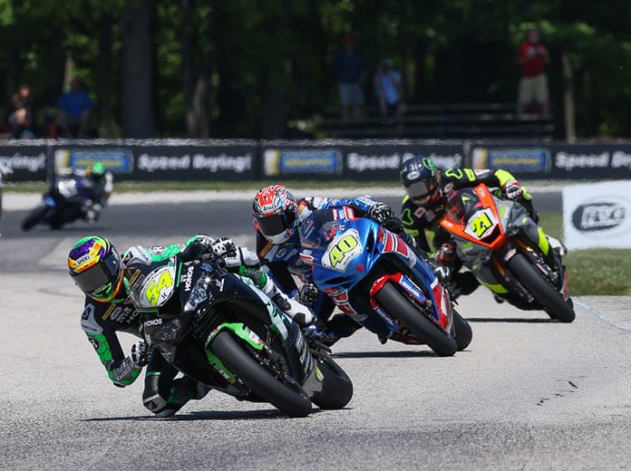 Richie Escalante (54) kept his perfect season alive in Supersport with a win over Sean Dylan Kelly (40) and Brandon Paasch (21). (Brian J. Nelson Photo)