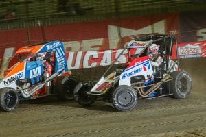 Christopher Bell (84) battles Kyle Larson for the race lead during Saturday's Lucas Oil Chili Bowl Nationals finale. (Brendon Bauman Photo)