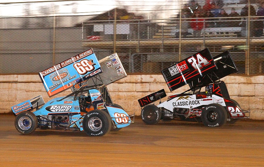 Lance Dewease (69k) battles Kerry Madsen during Saturday's Port Royal Speedway opener. (Dan Demarco Photo)