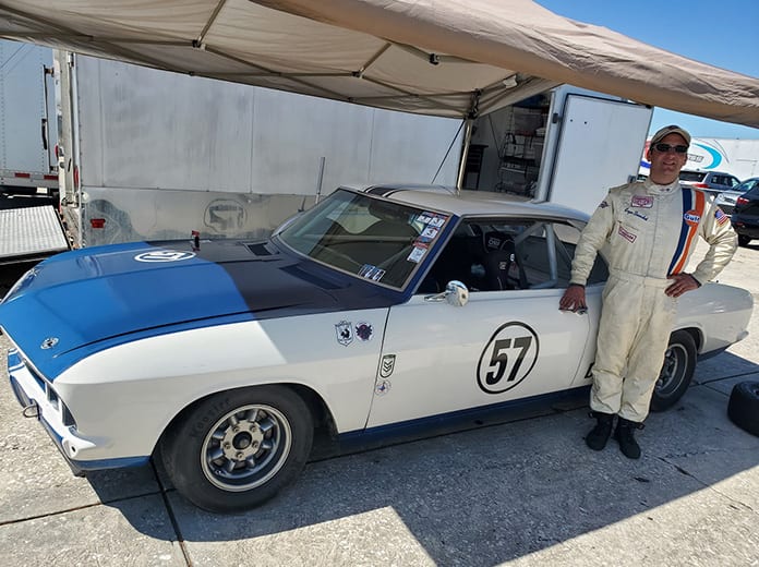 Logan Dernoshek stands alongside the Yenko Stinger Corvair he'll drive on the Charlotte Motor Speedway ROVAL next week. (Aaron Creed Photo)