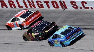 DARLINGTON, SOUTH CAROLINA - MAY 09: Kyle Larson, driver of the #5 HendrickCars.com Throwback Chevrolet, Austin Dillon, driver of the #3 Bass Pro Shops Chevrolet, and Chris Buescher, driver of the #17 Fifth Third Bank Ford, race during the NASCAR Cup Series Goodyear 400 at Darlington Raceway on May 09, 2021 in Darlington, South Carolina. (Photo by Sean Gardner/Getty Images) | Getty Images