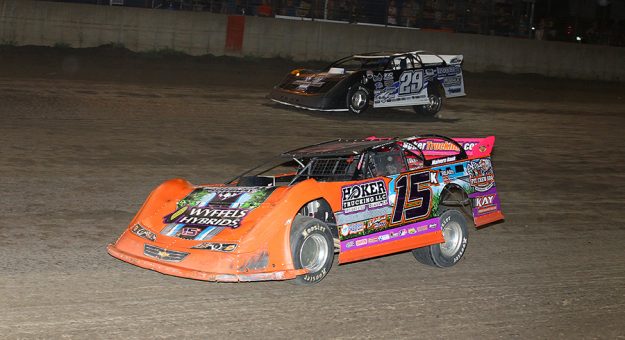 Justin Kay (15) overtakes Spencer Diercks Friday night at Davenport Speedway. (Mike Ruefer Photo)