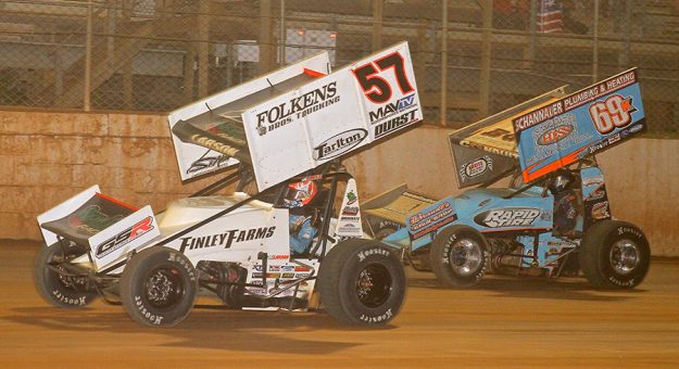 Kyle Larson (57) battles Lance Dewease Wednesday at Port Royal Speedway. (Dan Demarco Photo)