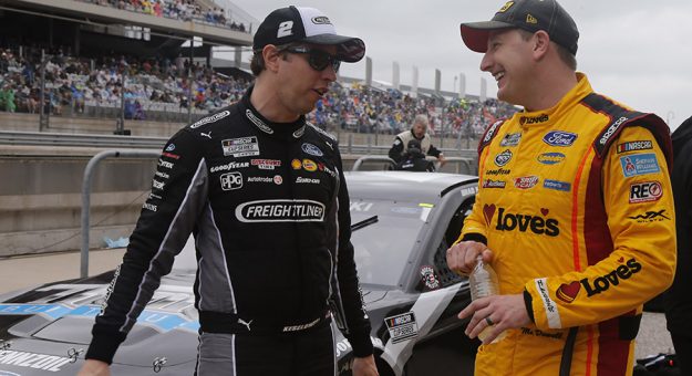 Brad Keselowski (left) chats with Michael McDowell at Circuit of the Americas. (HHP/Tim Parks Photo)