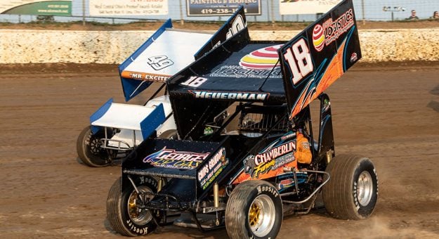 Todd Heuerman (18) and Shawn Dancer race for the lead on the first lap of the NRA Sprint Invader Invitational feature at Limaland Motorsports Park. (Mike Campbell Photo)