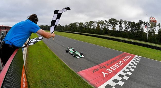 Reece Gold takes the checkered flag Saturday at New Jersey Motorsports Park.