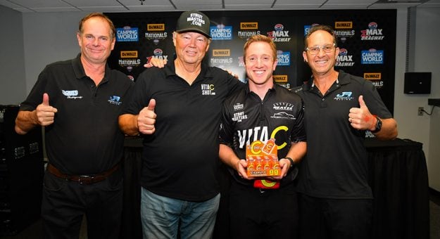 Justin Ashley Racing Marketing Director Roch Bailey, Chip Lofton, Justin Ashley and Mike Ashley after the announcement that Vita C Shot would sponsor Justin Ashley in the NHRA Top Fuel category. (Ron Lewis Photo)