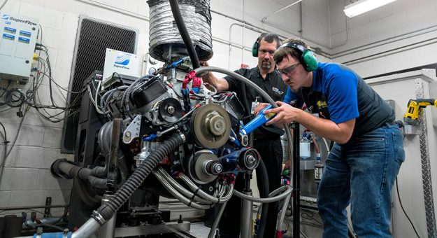 Darrell Hoffman with a student in the dyno lab at the NASCAR Technical Institute.