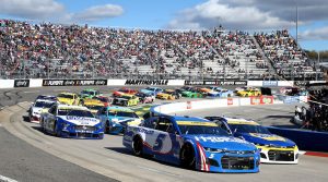 MARTINSVILLE, VIRGINIA - OCTOBER 31: Kyle Larson, driver of the #5 HendrickCars.com Chevrolet, and Chase Elliott, driver of the #9 NAPA Auto Parts Chevrolet, lead the field during the NASCAR Cup Series Xfinity 500 at Martinsville Speedway on October 31, 2021 in Martinsville, Virginia. (Photo by Brian Lawdermilk/Getty Images) | Getty Images