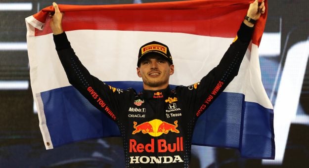 ABU DHABI, UNITED ARAB EMIRATES - DECEMBER 12: Race winner and 2021 F1 World Drivers Champion Max Verstappen of Netherlands and Red Bull Racing celebrates on the podium during the F1 Grand Prix of Abu Dhabi at Yas Marina Circuit on December 12, 2021 in Abu Dhabi, United Arab Emirates. (Photo by Kamran Jebreili - Pool/Getty Images) // Getty Images / Red Bull Content Pool  // SI202112120429 // Usage for editorial use only // | Getty Images