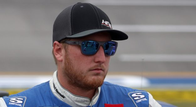 TALLADEGA, ALABAMA - OCTOBER 02: Austin Hill, driver of the #16 United Rentals Toyota, waits on the grid prior to the NASCAR Camping World Truck Series Chevrolet Silverado 250 at Talladega Superspeedway on October 02, 2021 in Talladega, Alabama. (Photo by Chris Graythen/Getty Images) | Getty Images