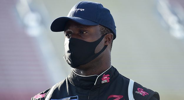 BROOKLYN, MICHIGAN - AUGUST 07: Jesse Iwuji, driver of the #33 G2 Xchange Toyota, waits on the grid prior to the NASCAR Gander RV & Outdoors Truck Series Henry Ford Health System 200 at Michigan International Speedway on August 07, 2020 in Brooklyn, Michigan. (Photo by Jared C. Tilton/Getty Images) | Getty Images