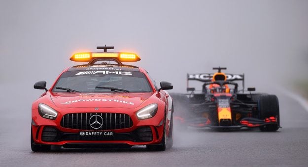 SPA, BELGIUM - AUGUST 29: The FIA Safety Car leads Max Verstappen of the Netherlands driving the (33) Red Bull Racing RB16B Honda and the rest of the field at the restart during the F1 Grand Prix of Belgium at Circuit de Spa-Francorchamps on August 29, 2021 in Spa, Belgium. (Photo by Lars Baron/Getty Images)