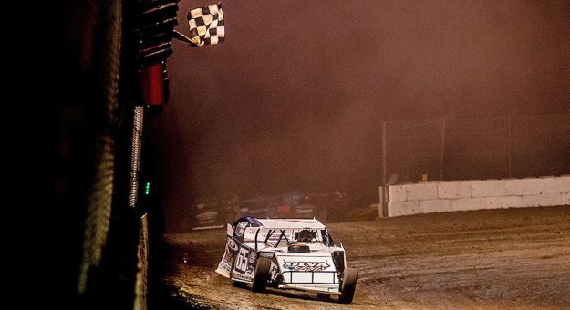 Tyler Davis takes the checkered flag at Rocket Raceway Park. (USMTS photo)