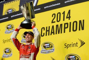 HOMESTEAD, FL - NOVEMBER 16:  Kevin Harvick, driver of the #4 Budweiser Chevrolet, celebrates with the trophy in victory lane after winning the NASCAR Sprint Cup Series Ford EcoBoost 400 at Homestead-Miami Speedway on November 16, 2014 in Homestead, Florida.  (Photo by Robert Laberge/Getty Images) | Getty Images