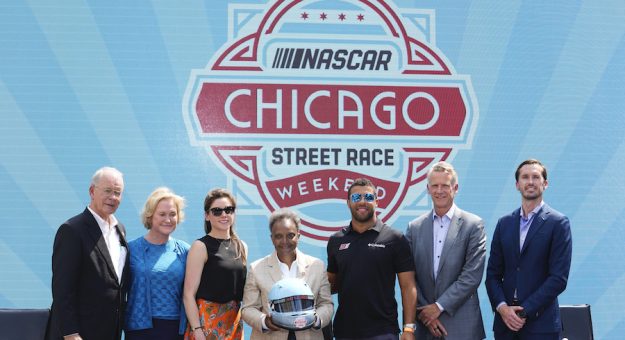 CHICAGO, ILLINOIS - JULY 19: (L-R) NASCAR and IMSA Chairman Jim France, NASCAR Executive Vice Chair Lesa France Kennedy, Kara Bauchman, Chicago Mayor Lori Lightfoot, Bubba Wallace, NASCAR President Steve Phelps, and NASCAR Senior Vice President of Strategy and Innovation Ben Kennedy pose for a photo after a press conference in promotion of the NASCAR Chicago Street Race announcement on July 19, 2022 in Chicago, Illinois. (Photo by Patrick McDermott/Getty Images) | Getty Images