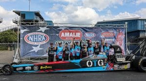 Julie Nataas celebrates with her Randy Meyer Racing team following her victory at the Gatornationals.