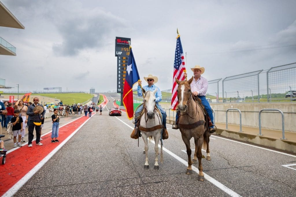 The Texas and American flags are presented during opening ceremonies of the GT World Challenge at Circuit of the Americas (SRO Image)