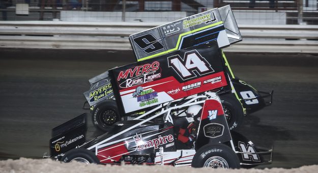 #9 Kyle Jones Passes #14 Joey Danley At The Finish Line Belleville 305 8 3 24 , Jeff Taylor Photo