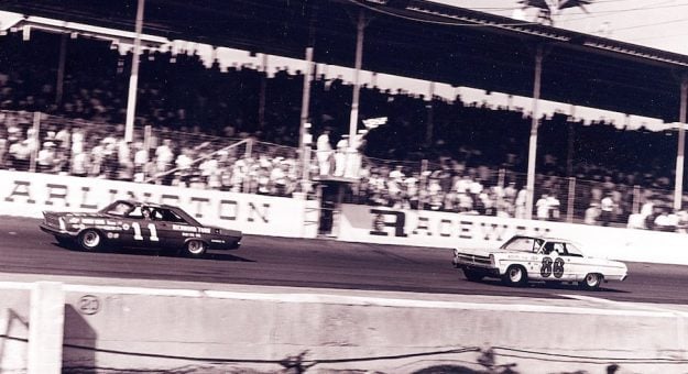 DARLINGTON, SC - SEPTEMBER 6, 1965:  Factory Ford driver Ned Jarrett won the Southern 500 in 1965, beating Buck Baker?s Plymouth (No. 86) by 14 laps, the widest margin of victory in NASCAR Cup Series history. Buck?s son, Buddy, drove relief for him at the finish. (Photo by RacingOne/Getty Images)